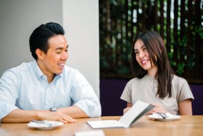 Students smiling having a discussion.