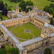 Arial-view-of-a-historic-university-campus-with-a-large-central-quadrangle-and-surrounding-gothic-buildings
